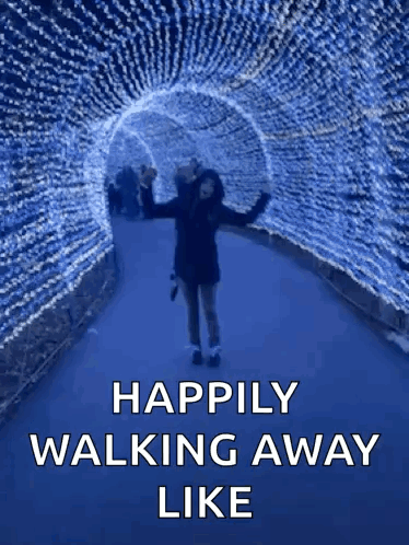 A Woman Is Walking Through A Tunnel Of Lights With The Words " Happily Walking Away Like " GIF