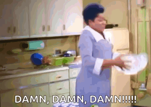 A Woman Is Washing Dishes In A Kitchen And Says Damn Damn Damn GIF