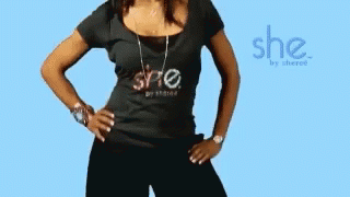 A Woman Is Wearing A Black Shirt That Says She GIF