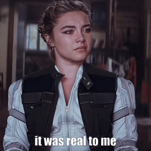A Woman Is Wearing A Black Vest And A White Shirt And Says It Was Real To Me GIF