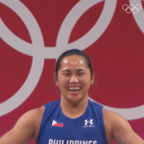 A Woman Is Wearing A Blue Tank Top That Says Philippines On It GIF