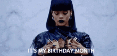 A Woman Is Wearing A Crown On Her Head . GIF