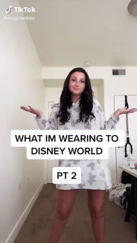 A Woman Is Wearing A Disney World Dress And A Tiktok Video GIF