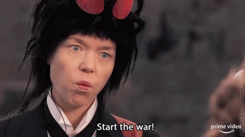 a woman is wearing a fly costume and making a funny face .