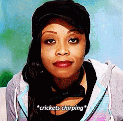 A Woman Is Wearing A Hat And A Hoodie And Says Crickets Chirping GIF