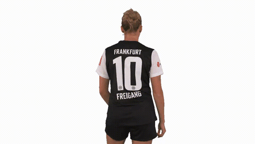 A Woman Is Wearing A Jersey With The Number 10 On The Back GIF