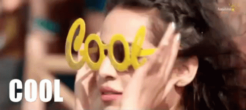 A Woman Is Wearing A Pair Of Yellow Sunglasses That Say Cool . GIF