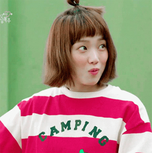 A Woman Is Wearing A Pink And White Striped Shirt That Says Camping GIF