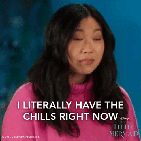 A Woman Is Wearing A Pink Sweater And Says I Literally Have The Chills Right Now . GIF