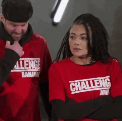A Woman Is Wearing A Red Shirt That Says The Challenge GIF