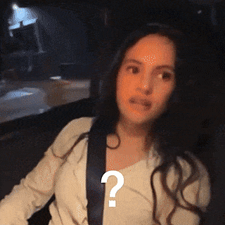 A Woman Is Wearing A Seat Belt And Has A Question Mark On Her Chest GIF