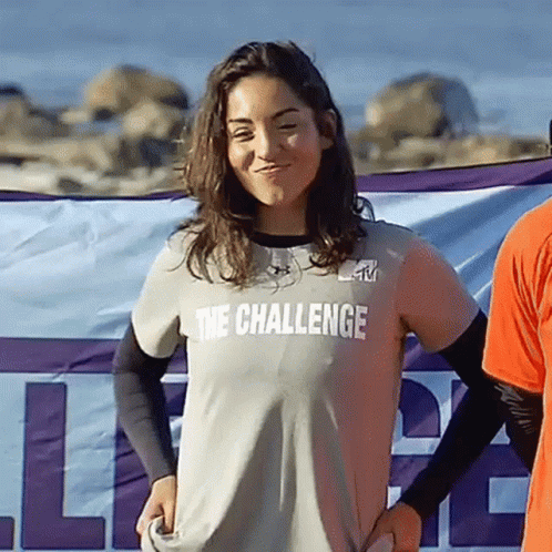 A Woman Is Wearing A Shirt That Says The Challenge On It GIF