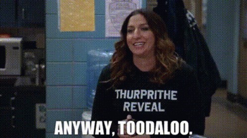 A Woman Is Wearing A T-Shirt That Says `` Thurprithe Reveal '' And Is Smiling . GIF