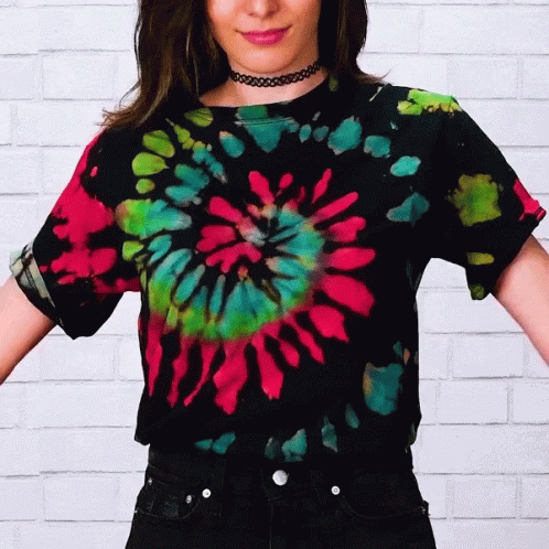 A Woman Is Wearing A Tie Dye Shirt GIF
