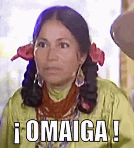 A Woman Is Wearing A Yellow Jacket And Earrings And Says Omaiga GIF