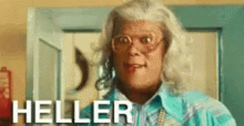 A Woman Is Wearing Glasses And A Blue Shirt And The Word Heller Is On The Bottom GIF