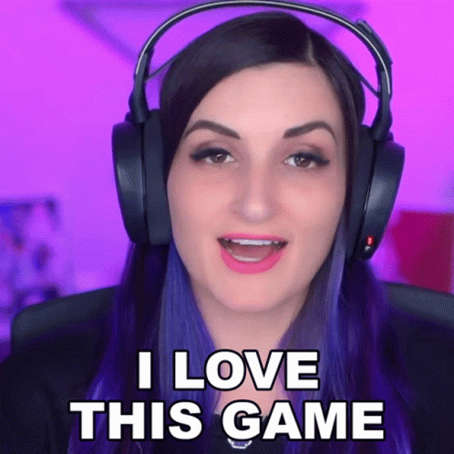 A Woman Is Wearing Headphones And Says I Love This Game GIF