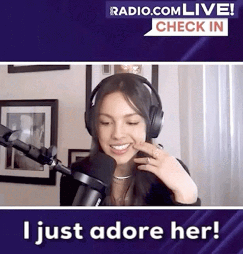 Woman Smiling With Headphones In Front Of Microphone GIF