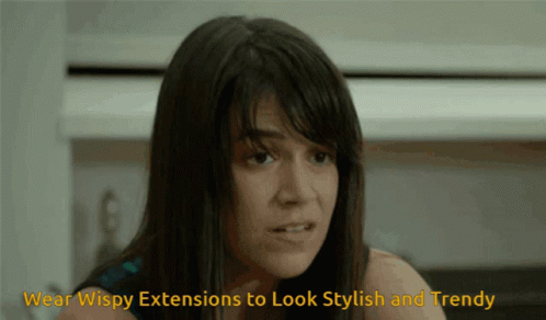 A Woman Is Wearing Wispy Extensions To Look Stylish And Trendy .. GIF