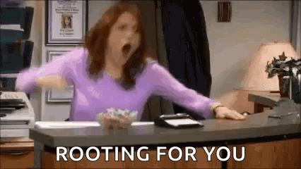 Yawning Woman Sitting At Desk With Rooting For You Text GIF