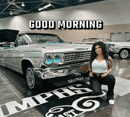 A Woman Kneeling In Front Of A Car With The Words Good Morning Written Above Her GIF
