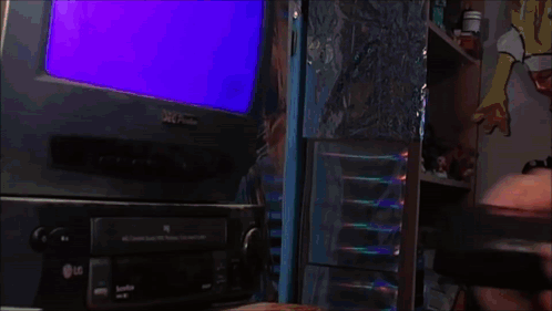 A Woman Laughs In Front Of An Lg Television GIF