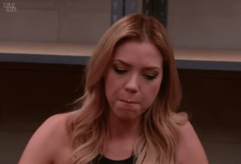 A Woman Laying Her Head On A Table With The Words Lulu Gifs On The Bottom Right GIF
