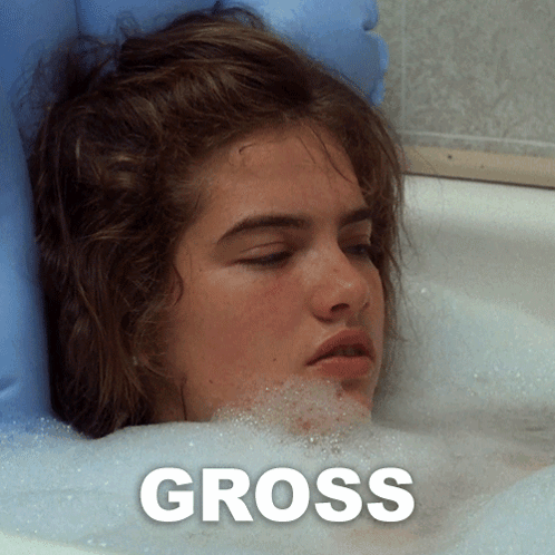 A Woman Laying In A Bathtub With The Word Gross On The Bottom GIF