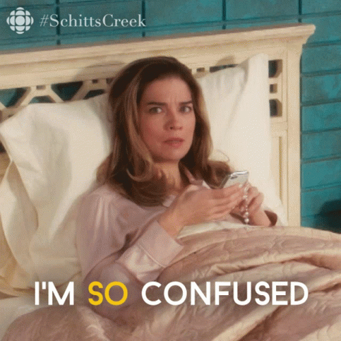 A Woman Laying In Bed With The Words I 'M So Confused In Yellow GIF