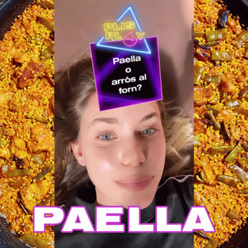 A Woman Laying In Front Of A Plate Of Paella GIF