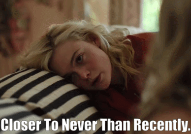A Woman Laying On A Bed With The Words " Closer To Never Than Recently " Below Her GIF