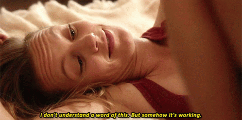 A Woman Laying On A Bed With The Words I Don 'T Understand A Word Of This GIF