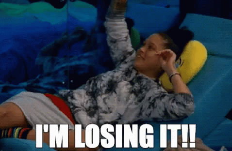 a woman laying on a bed with the words " i 'm losing it " written above her