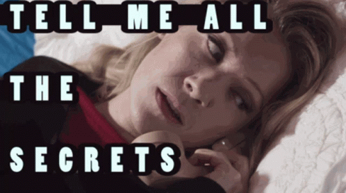 A Woman Laying On A Bed With The Words Tell Me All The Secrets Written Above Her GIF
