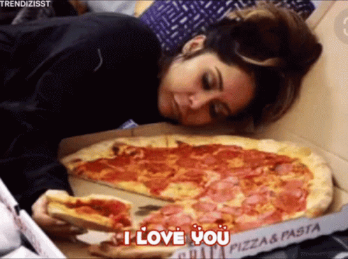 A Woman Laying On Top Of A Pizza Box With The Words " I Love You " On It GIF