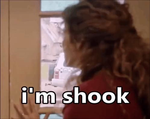 A Woman Looking Into A Refrigerator With The Words I 'M Shook Written On It GIF