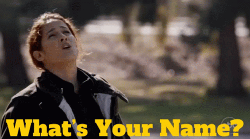 A Woman Looking Up With The Words What 'S Your Name Written Below Her GIF