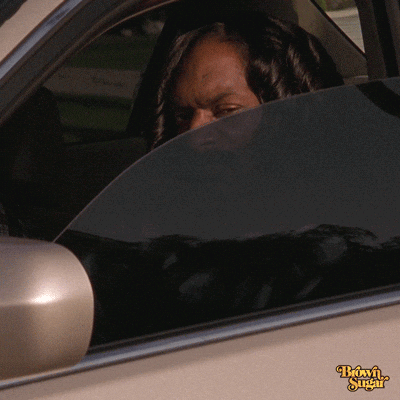 A Woman Looks Out Of A Car Window With The Words Brown Sugar On The Side GIF