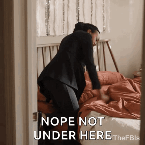 A Woman Making A Bed With The Words Nope Not Under Here Below Her GIF