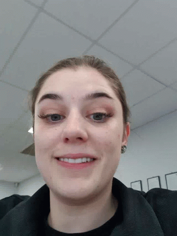 A Woman Making A Face With Her Tongue Out GIF