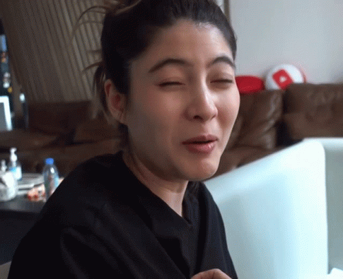 A Woman Making A Funny Face In Front Of A Computer Monitor GIF