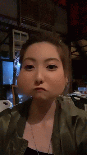 A Woman Making A Funny Face With A Big Nose GIF