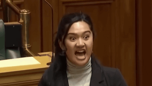 A Woman Making A Funny Face With Her Mouth Wide Open GIF