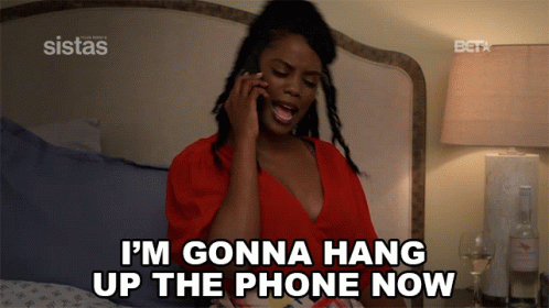 A Woman On A Bed Talking On A Cell Phone And Says I 'M Gonna Hang Up The Phone Now GIF
