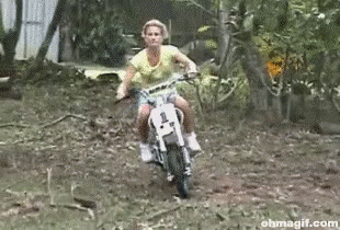 A Woman On A Dirt Bike With The Number 1 On The Front GIF