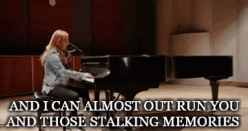 A Woman Playing A Piano With The Words " And I Can Almost Out Run You And Those Stalking Memories " Below GIF