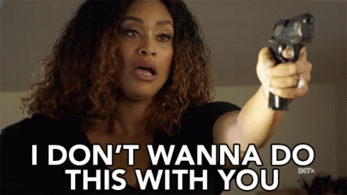 A Woman Pointing A Gun With The Words I Don T Wanna Do This With You Behind Her GIF
