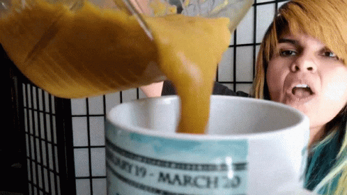 A Woman Pouring Something Into A Mug That Says March 20 On It GIF