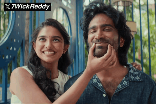 A Woman Putting Her Hand On A Man 'S Face With 7Wick Reddy Written On The Bottom GIF