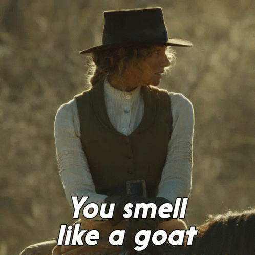 A Woman Riding A Horse With The Words You Smell Like A Goat GIF